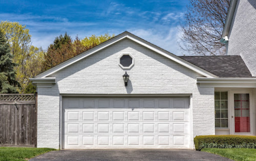 Garage door on a white home